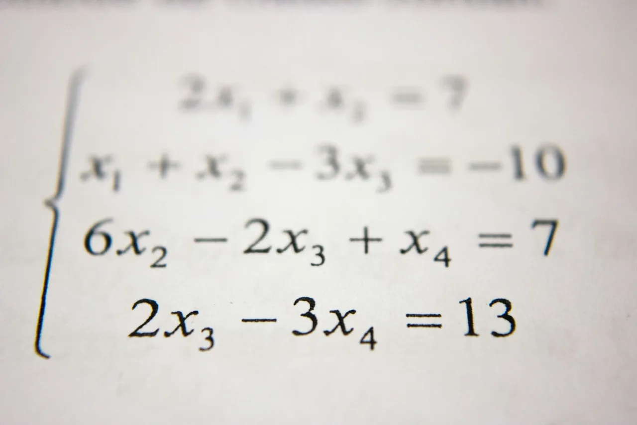 Close-up of math equations on an exam paper